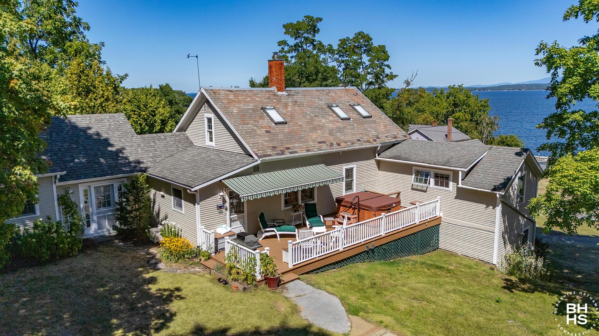 Image 4: EssexHomeWithLakeViews_A_Exterior_Back