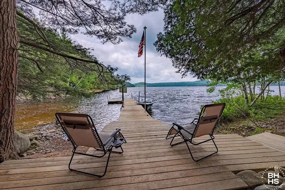 Image 1: CampBassRockOnTupperLake_Dock_Chairs