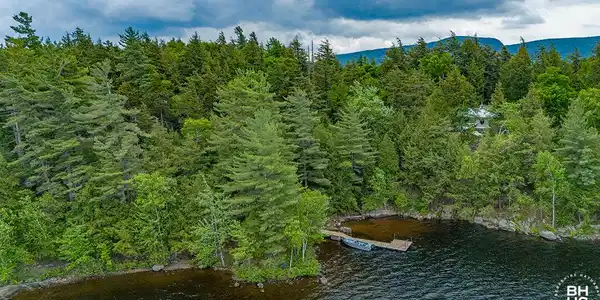 Image 2: CampBassRockOnTupperLake_A_MH_Dock_Low_M