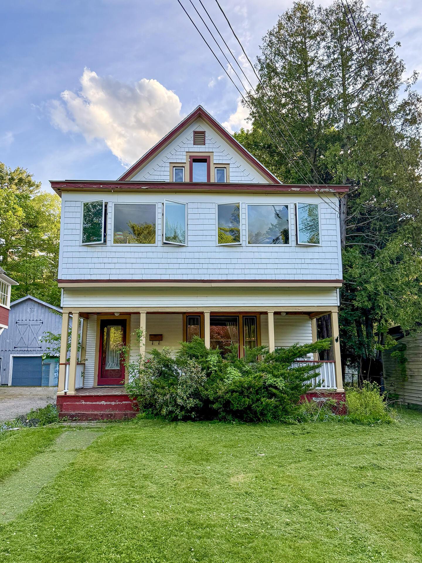 Image 1: HomeOnForestHillDrive_Spring_Exterior