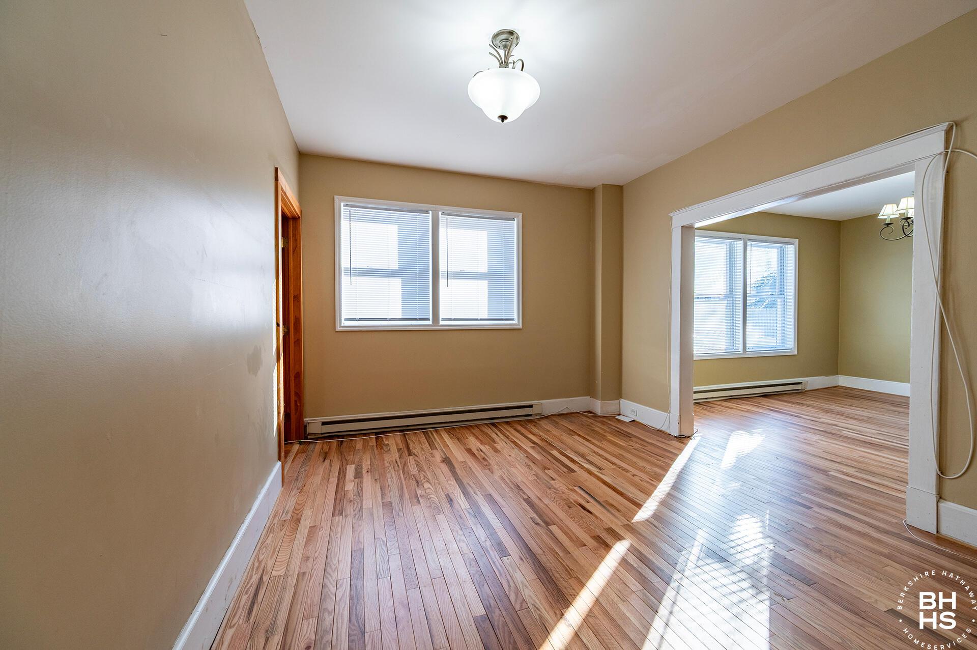 Image 2: ApartmentBuildingOnElm_Apt1_LR_From_Entr