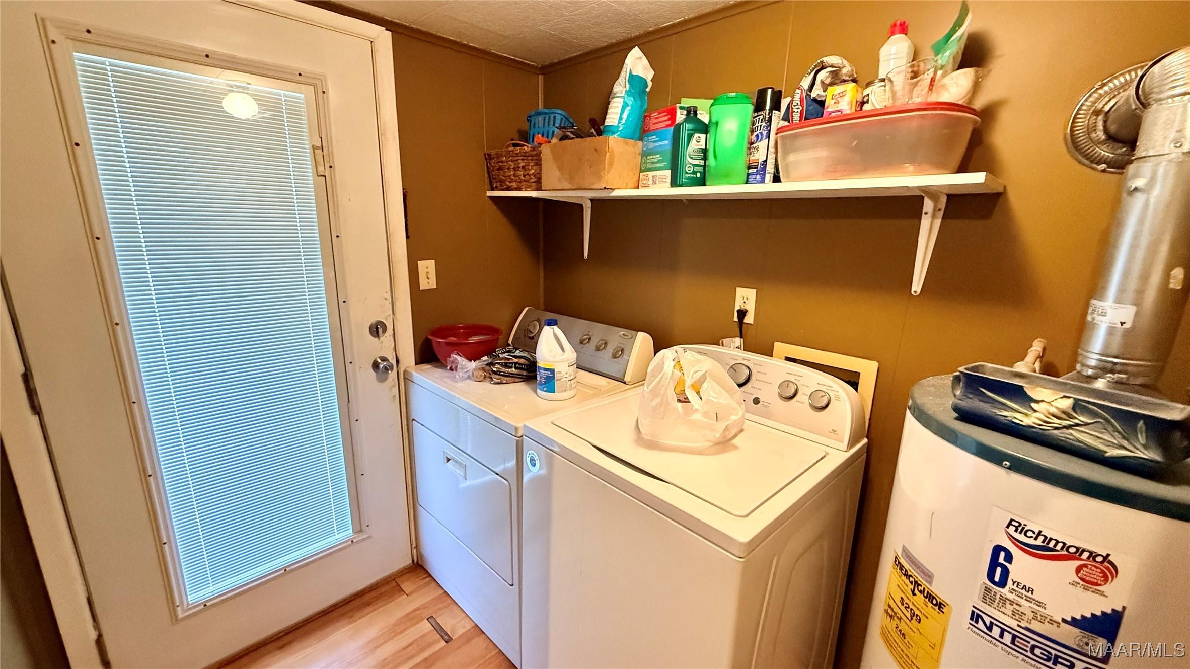 Image 3: Separate Laundry room - door that leads to outside