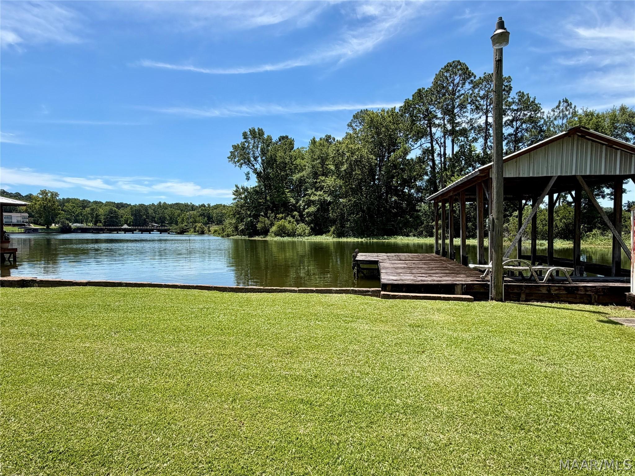 Image 2: Flat lot, 82 ft water front, convenient location,