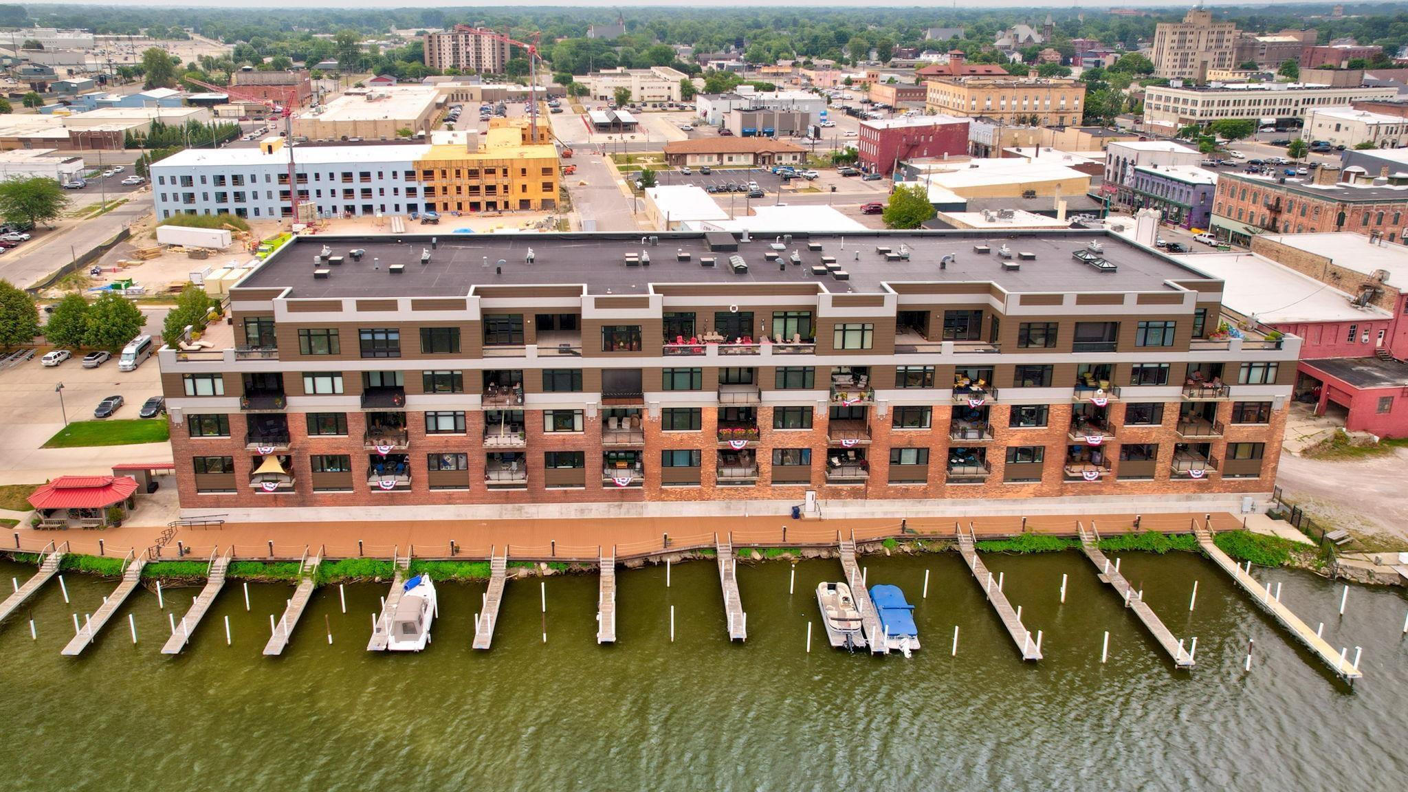 Image 0: Breathtaking river views, and you also are one of the few in the condo association that has your own private boat slip!