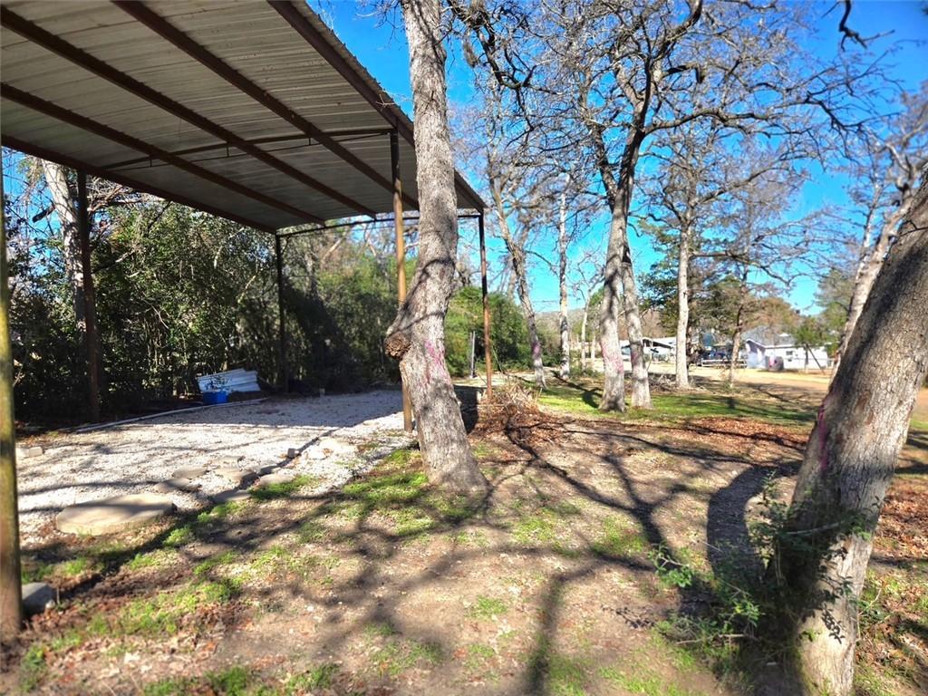 Image 2: View of yard and carport