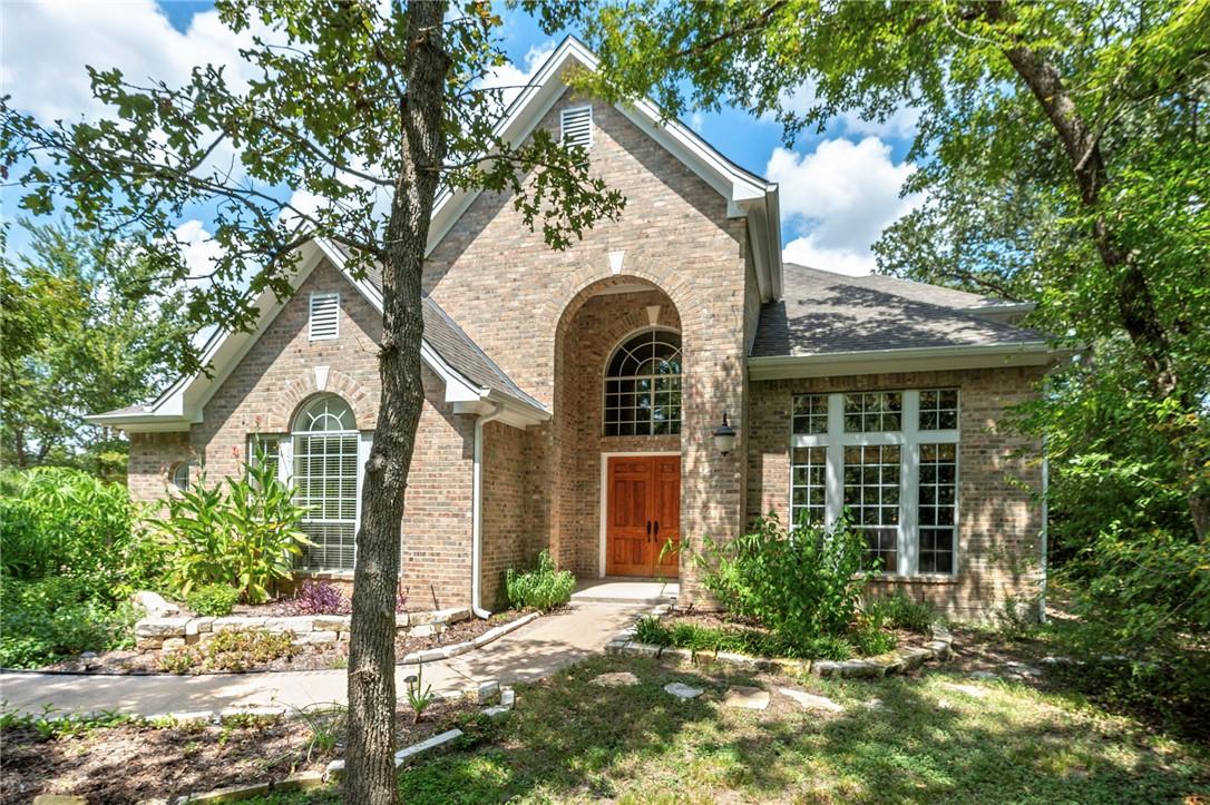 Image 1: Shaded by mature trees this stunning elevation and