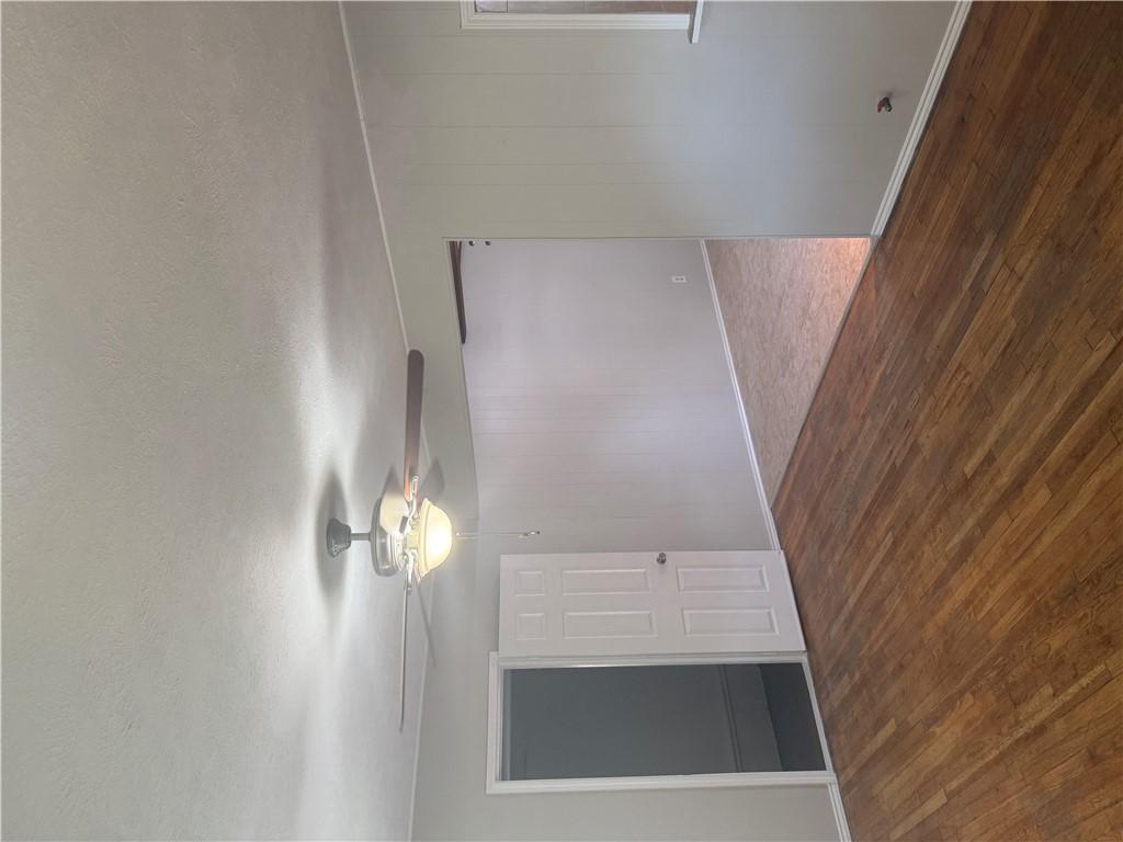 Image 4: Spare room with dark wood-style floors, a textured