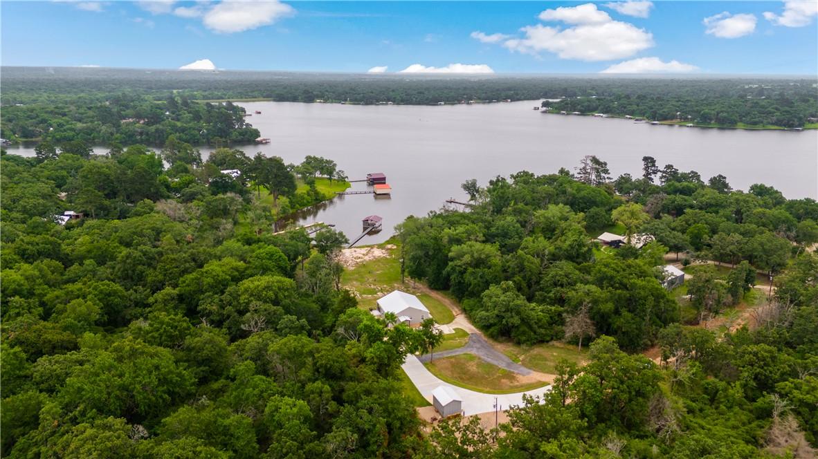 Image 3: Aerial view of a nearby body of water and a heavil