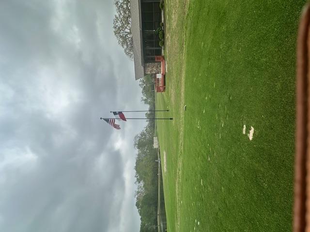 Image 1: View of home's community featuring a yard and a wo