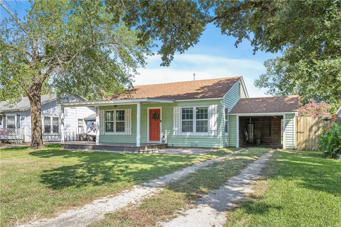 Image 1: Bungalow-style house with covered porch, a front l
