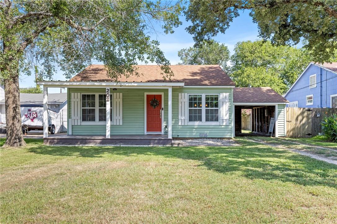 Image 2: Bungalow-style home with a porch and roof with shi