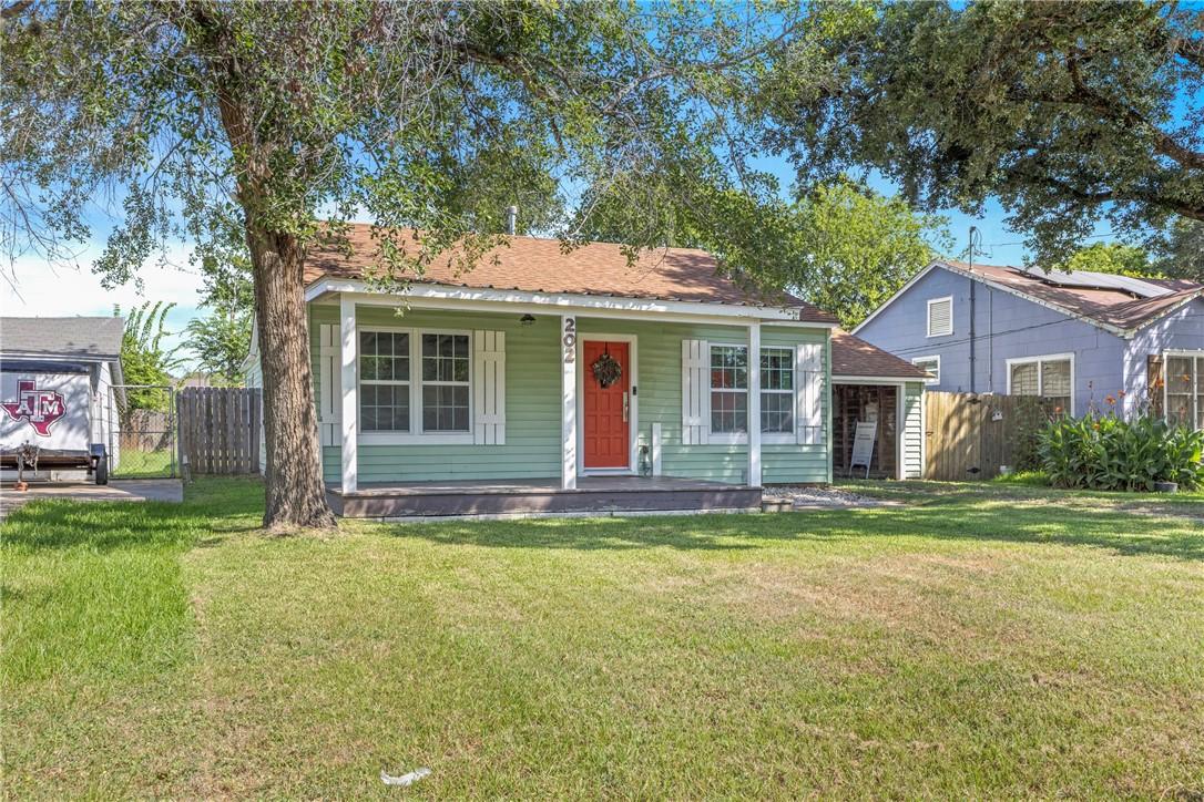 Image 3: Bungalow with covered porch and roof with shingles