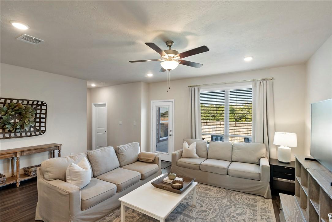 Image 4: Living room with recessed lighting, a ceiling fan,