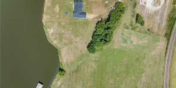 Image 2: Aerial overview of property's location with a larg