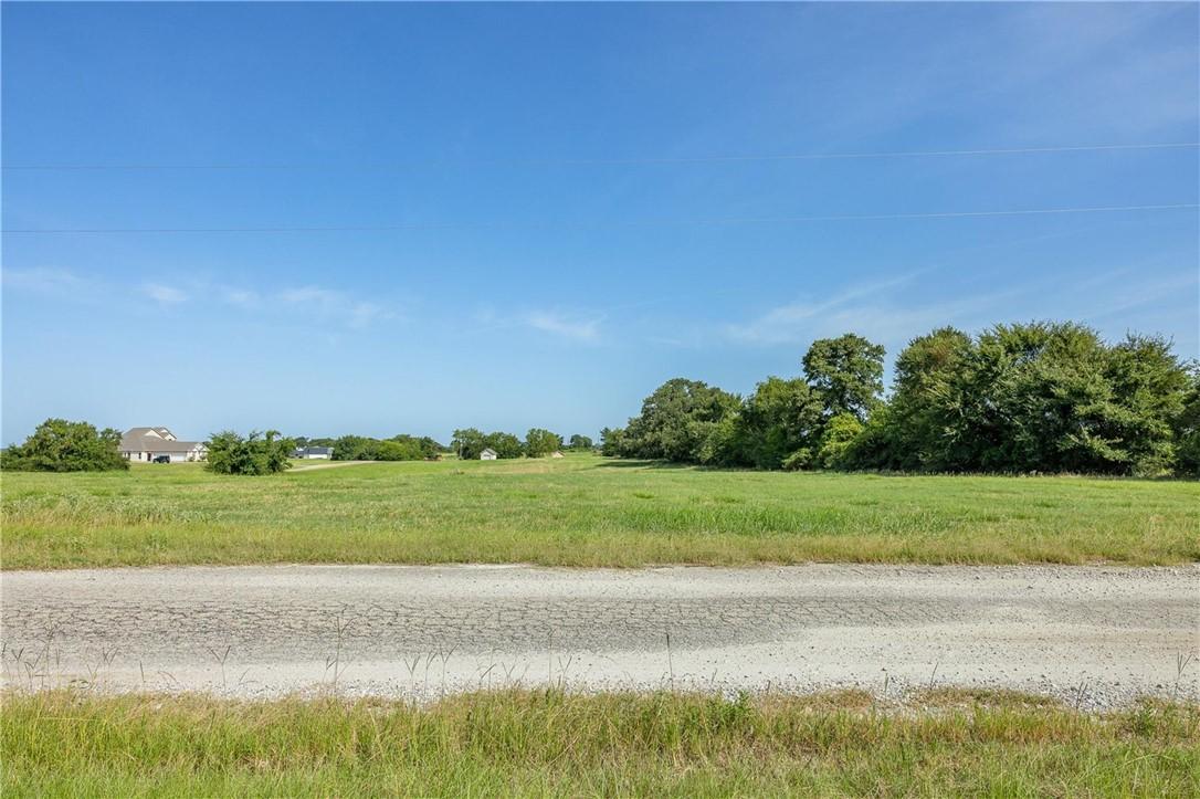 Image 3: View of road featuring a rural view
