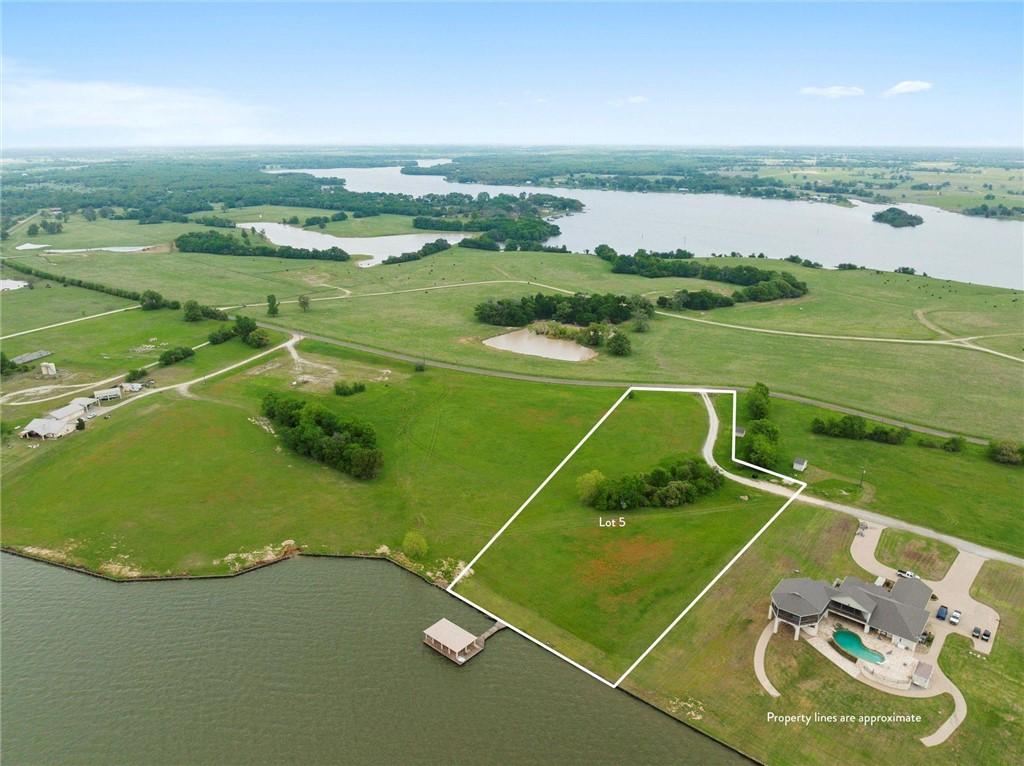 Image 2: View of rural area with a large body of water and