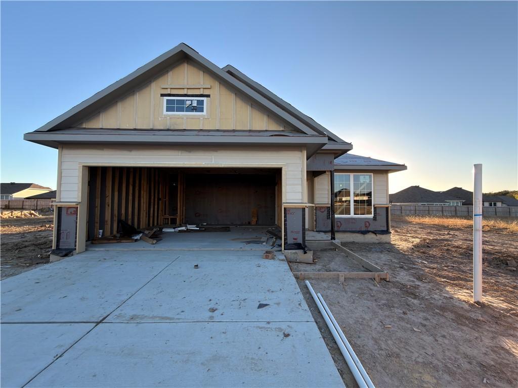 Image 1: View of front of home with board and batten siding