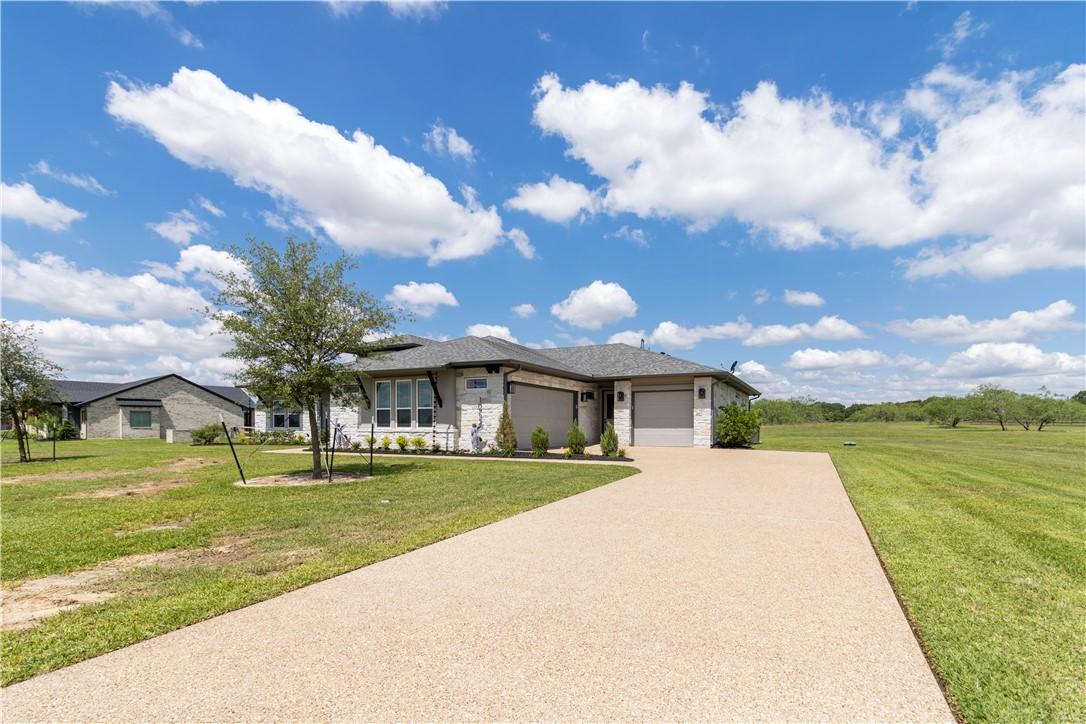 Image 3: View of front of house featuring a garage, a front