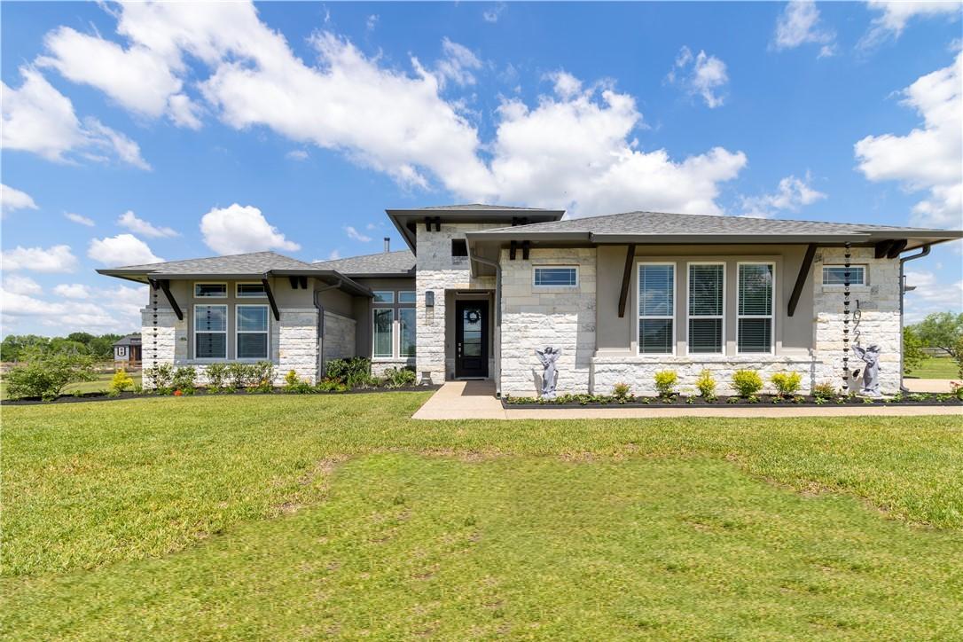 Image 4: Prairie-style home featuring stone siding and a fr