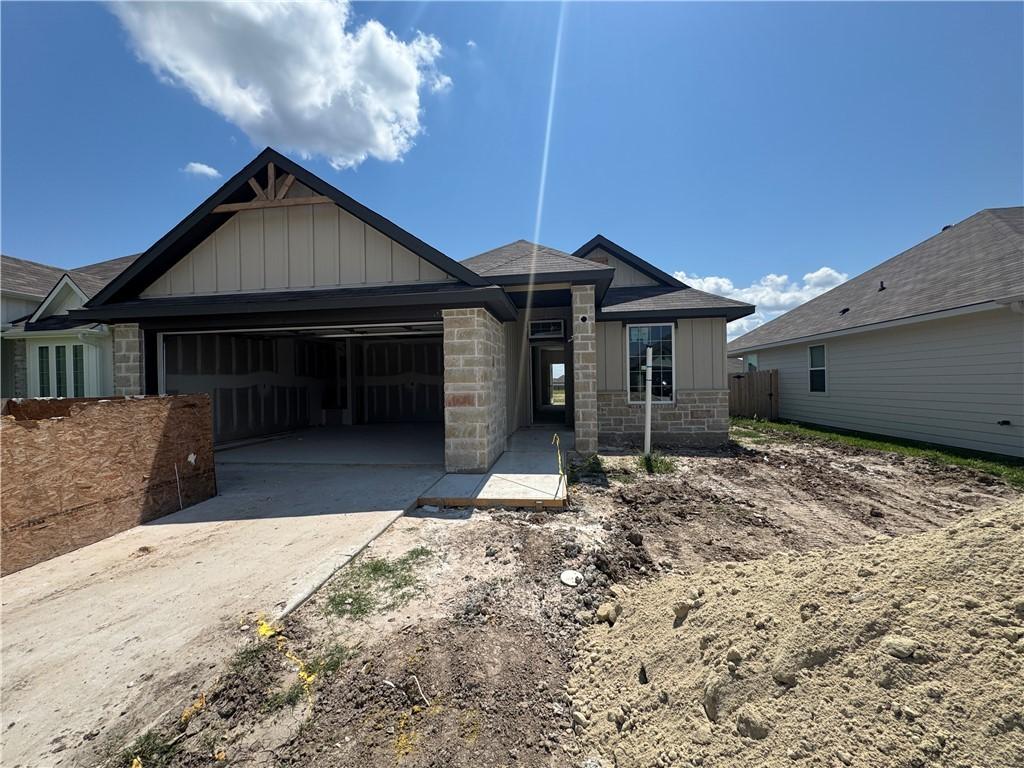 Image 2: View of front facade with board and batten siding,