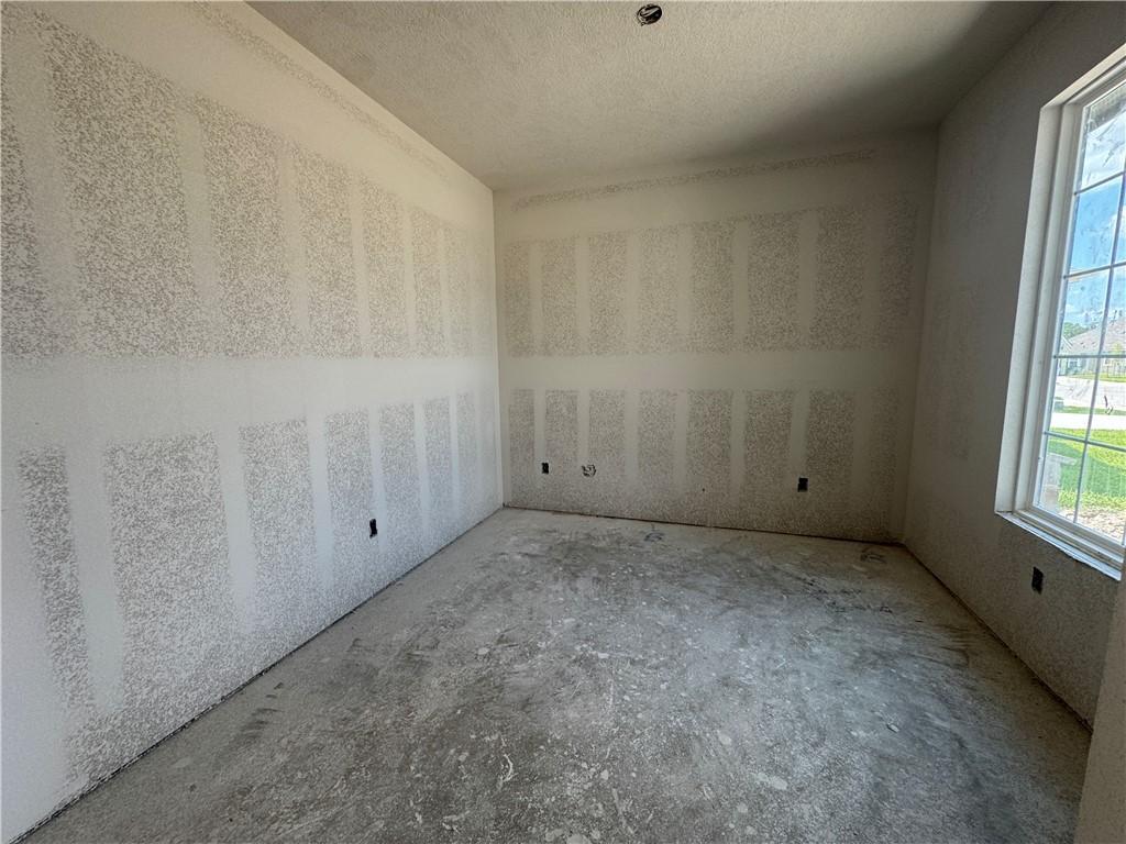 Image 4: Empty room with a textured ceiling