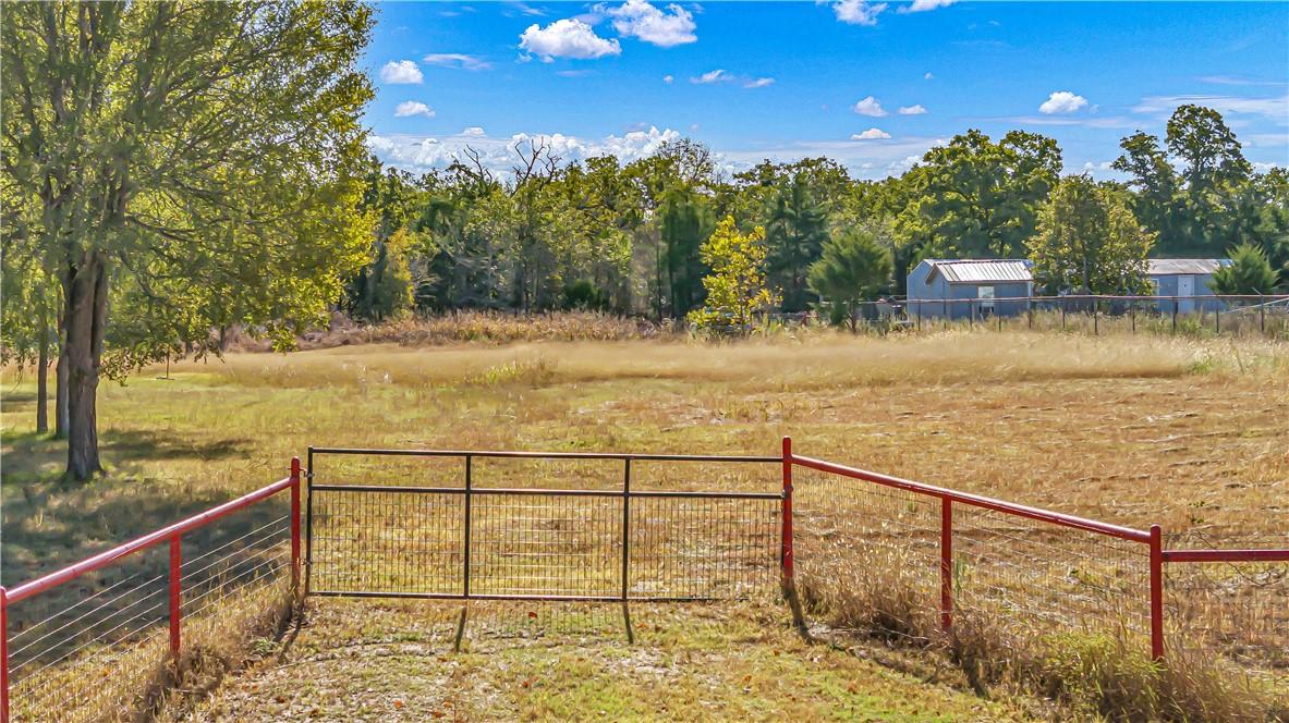 Image 4: View of yard featuring a rural view