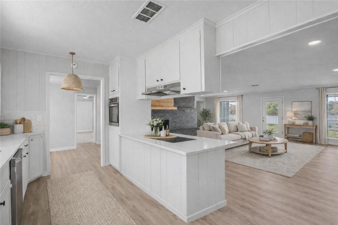 Image 3: Staged photo of the kitchen to living room