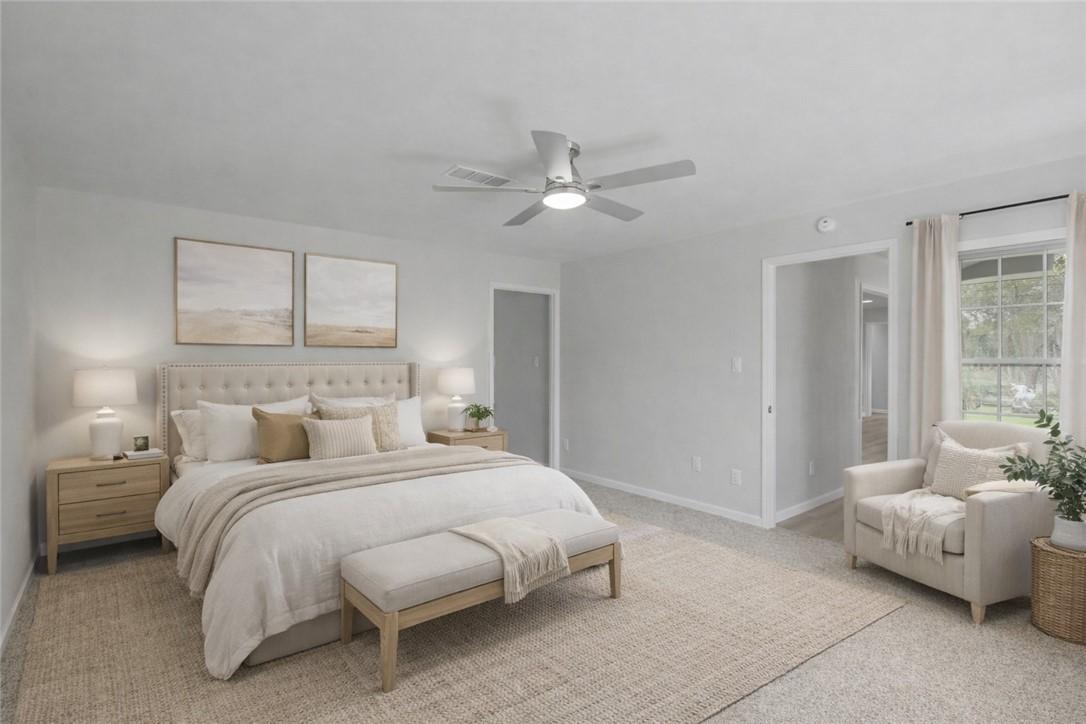 Image 4: staged photo of the master bedroom