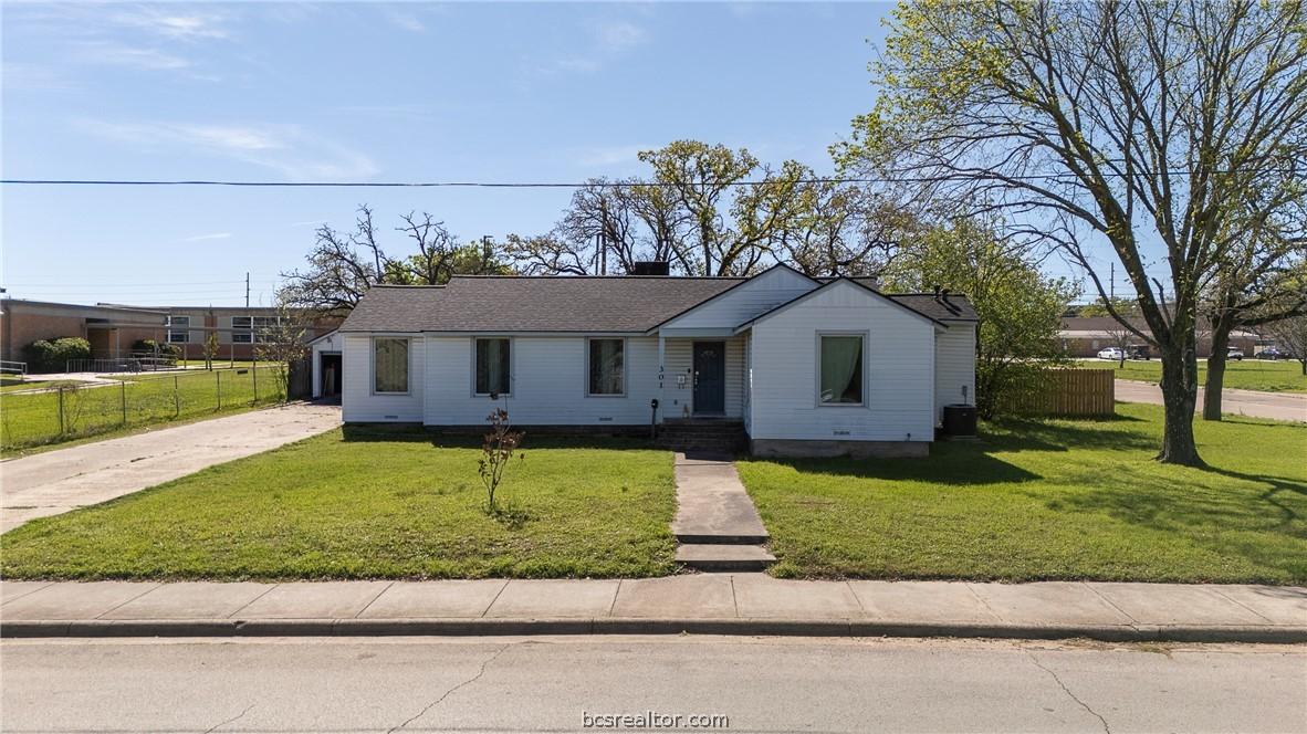 Image 4: Situated on a sprawling 0.33-acre corner lot, thi
