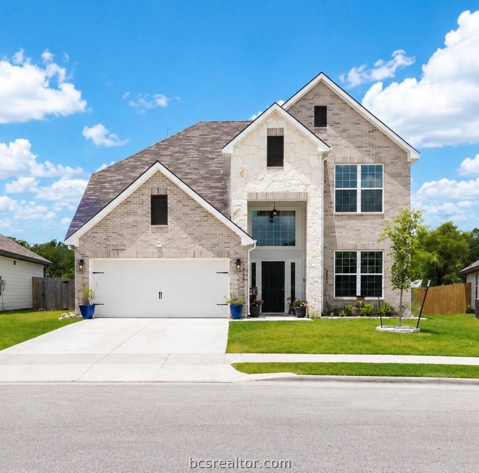 Image 1: The neutral brick and limestone combination create