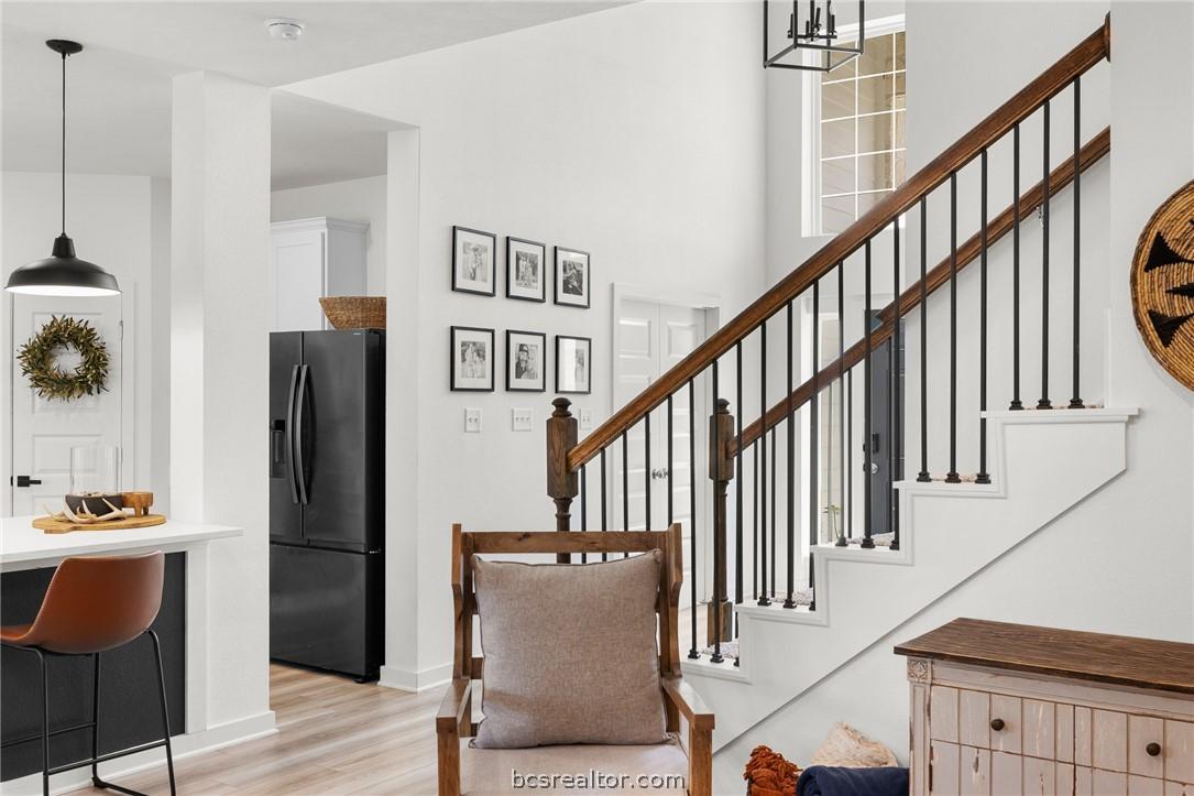 Image 2: Living room is open to the 2 story entryway, kitch