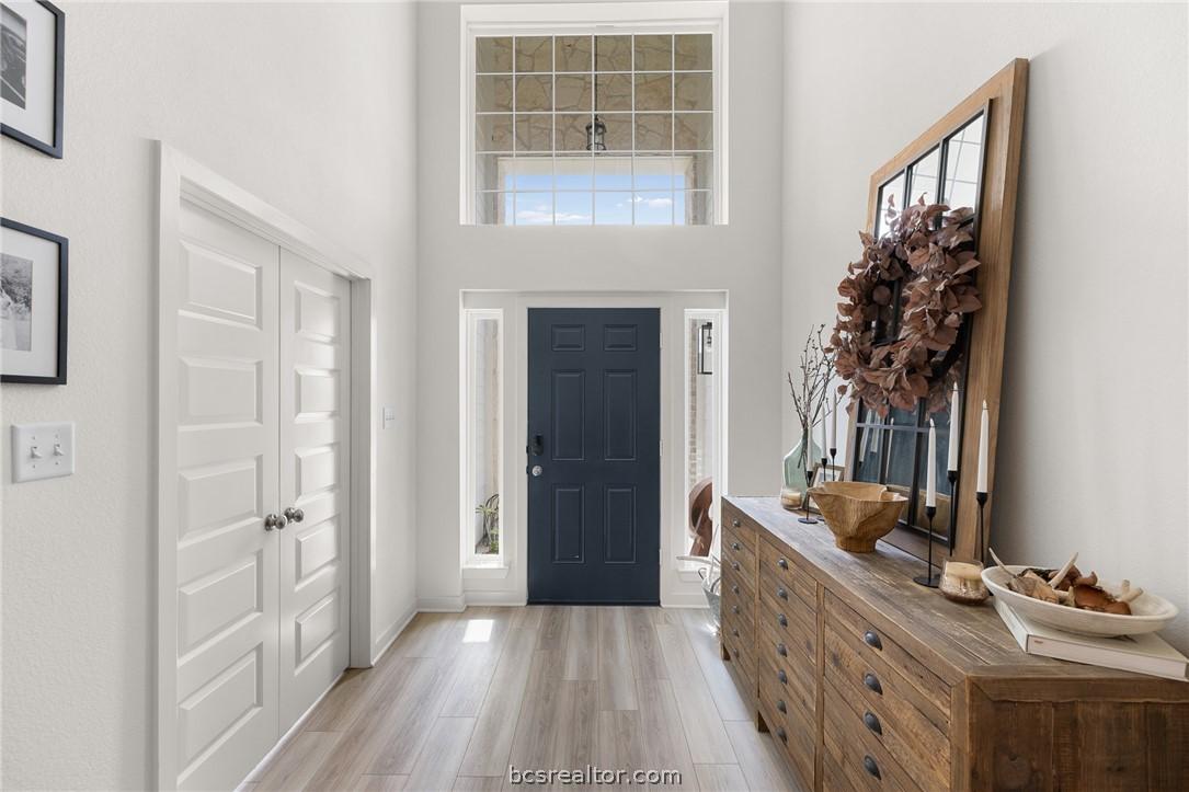 Image 4: 2 Story Entryway.  Balcony from upstairs looks ove