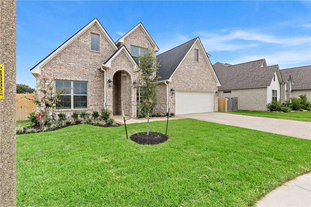 Image 2: Traditional-style house with concrete driveway, br