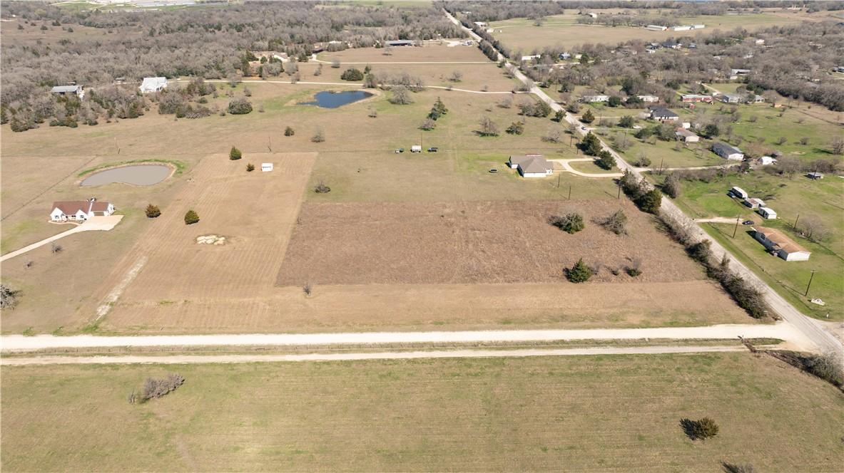 Image 4: Aerial view of property and surrounding area with
