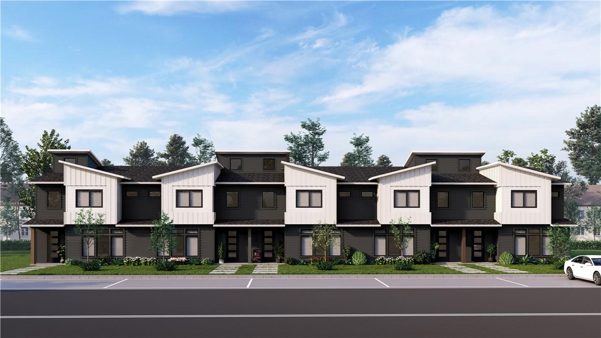 Image 1: View of front facade featuring a residential view