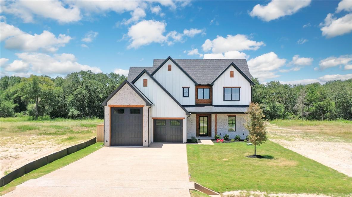 Image 1: Modern farmhouse style home with driveway, a garag