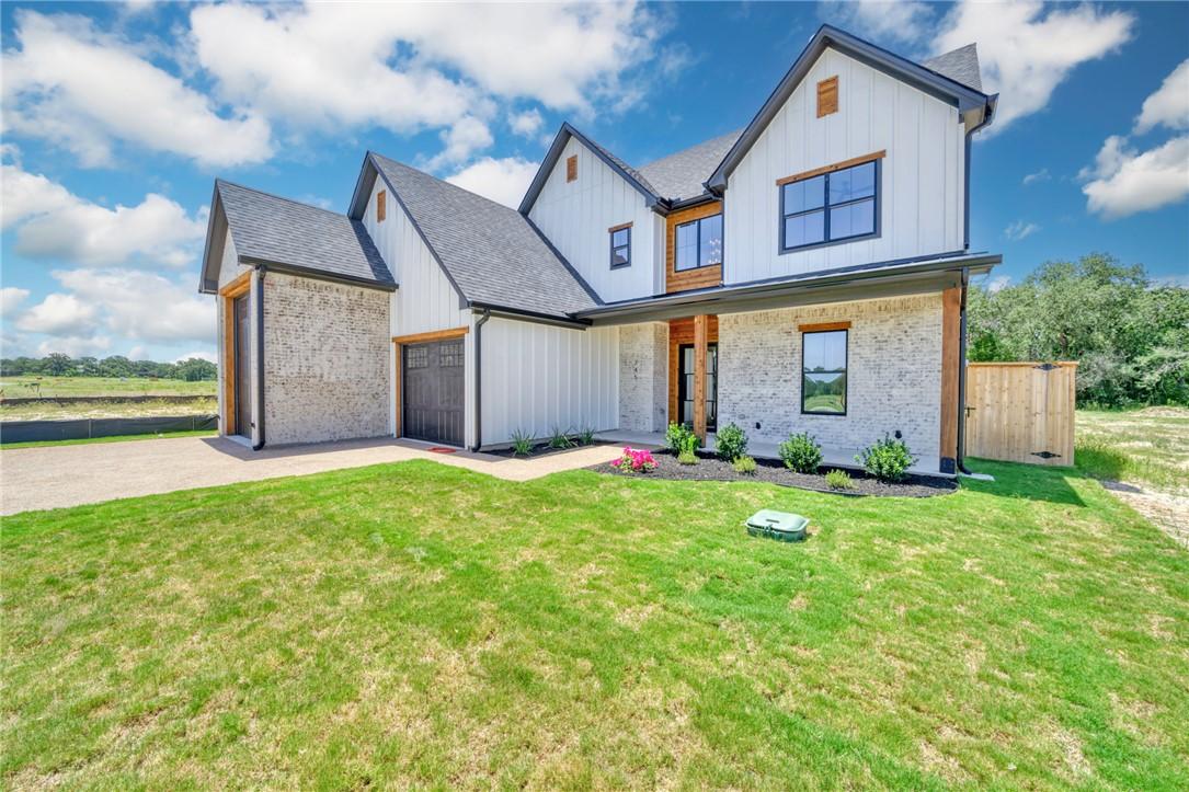 Image 4: Modern inspired farmhouse featuring an attached ga