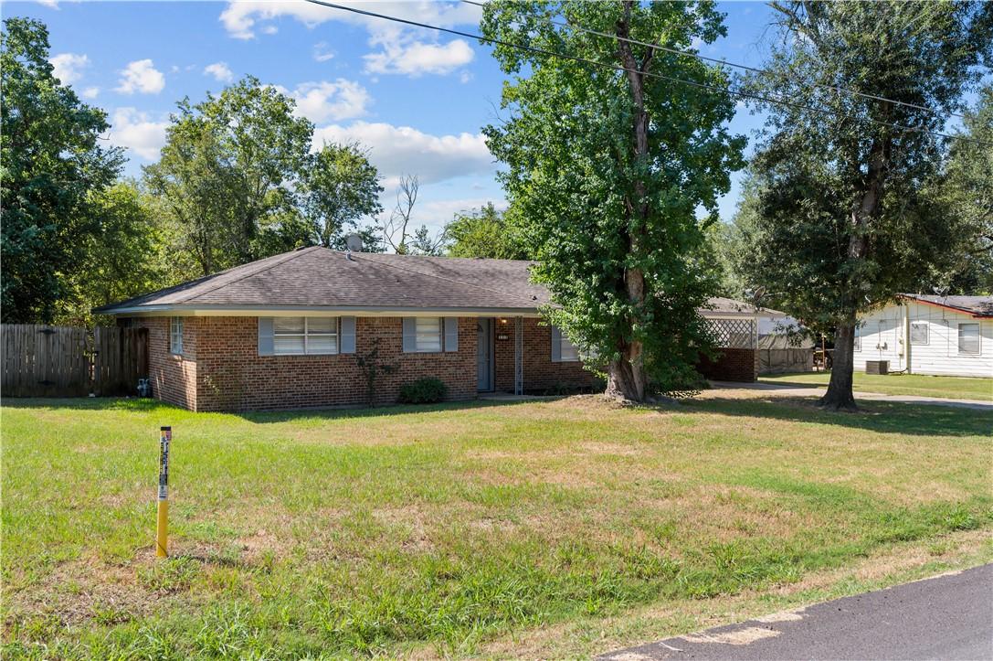 Image 3: Ranch-style house with brick siding