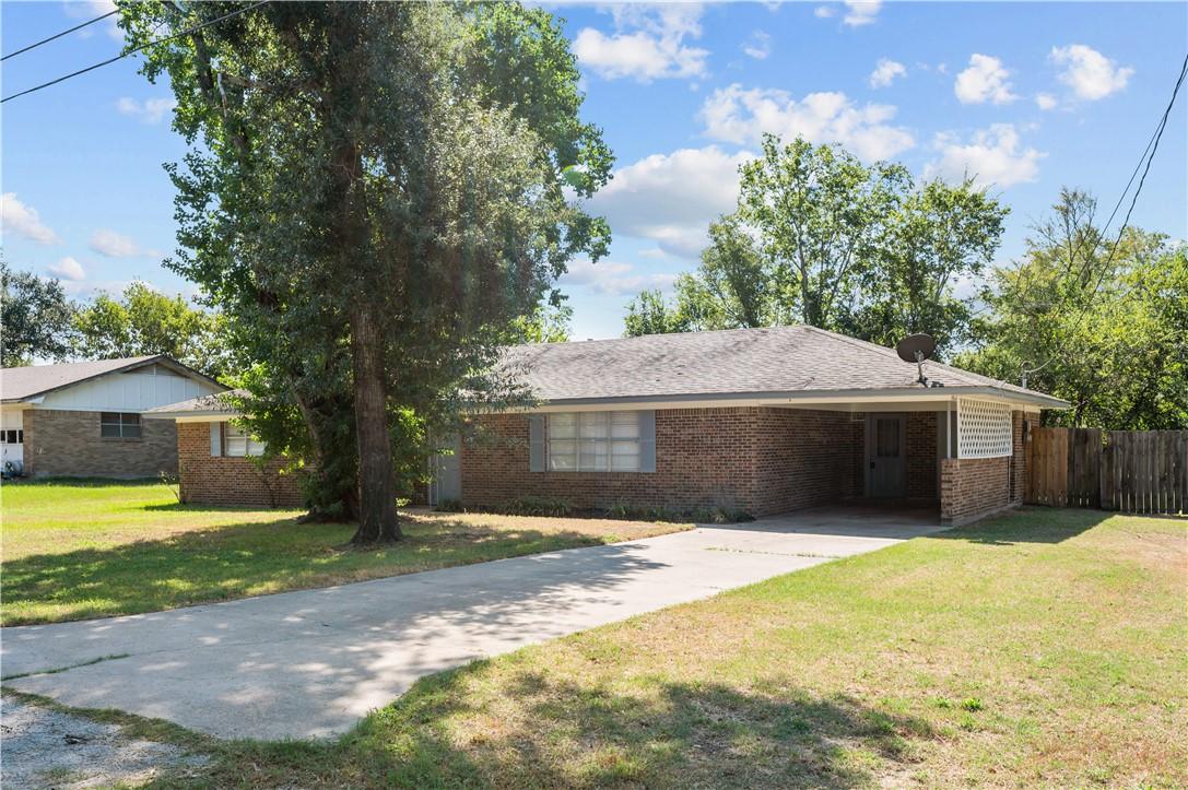 Image 4: Single story home featuring driveway, a carport, a