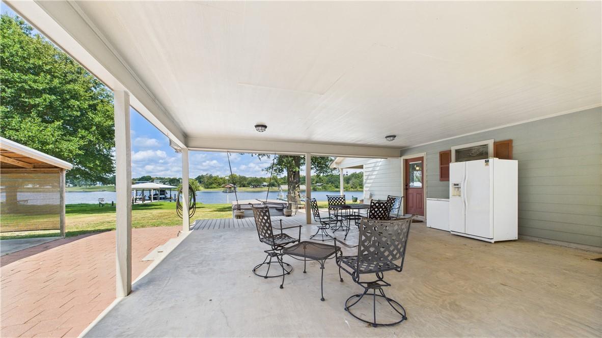Image 3: View of patio / terrace featuring a water view, a