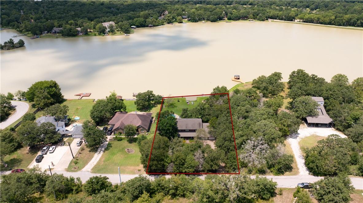 Image 3: View of property location featuring a forest and p