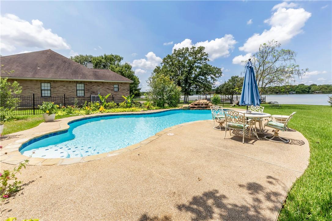 Image 4: View of swimming pool featuring a patio area