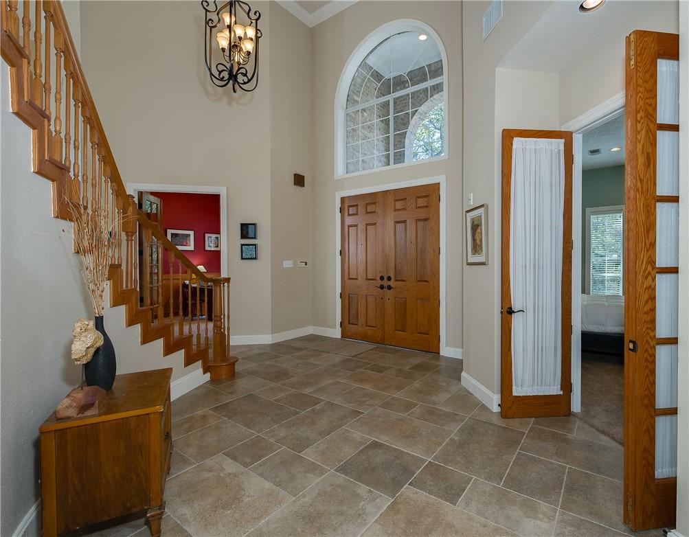 Image 3: The two-story entry offers soaring ceilings
