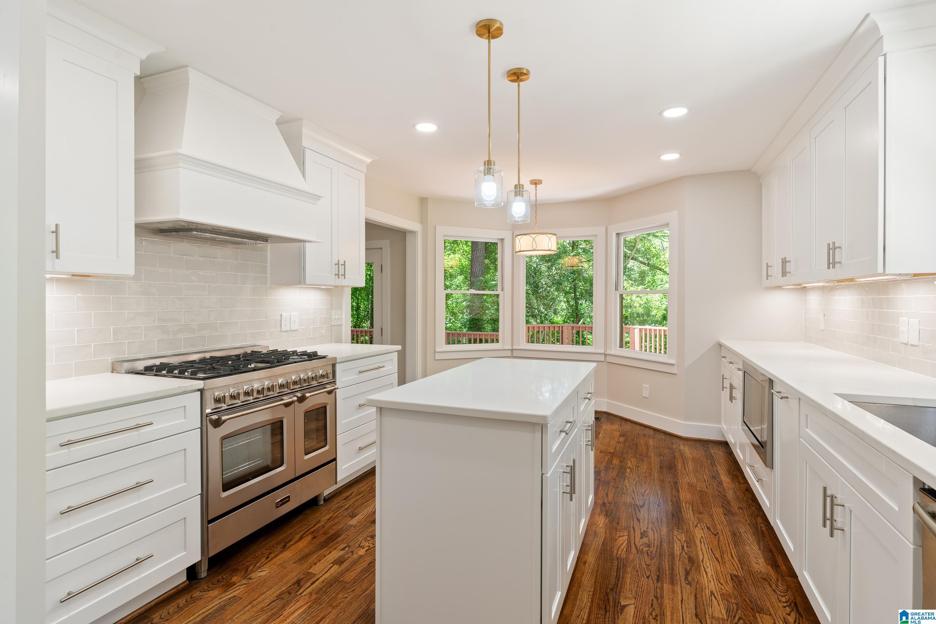 Image 1: Updated main level kitchen