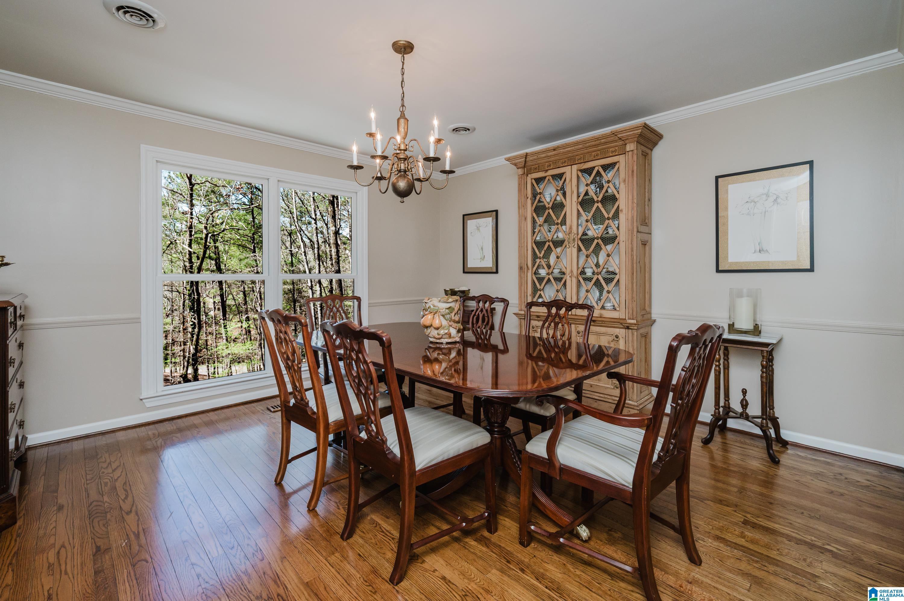 Image 3: Dining room with scenic view of private backyard