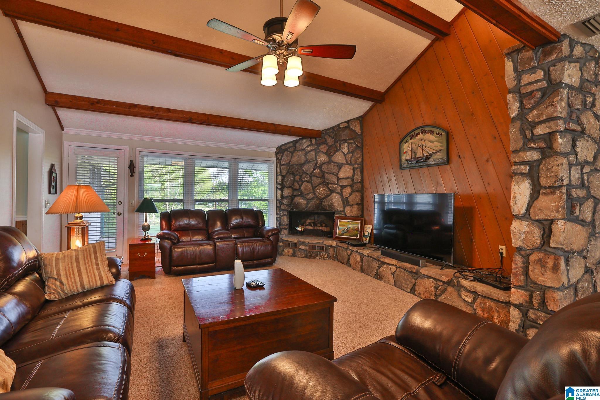 Image 3: Huge Den and Stone Fireplace