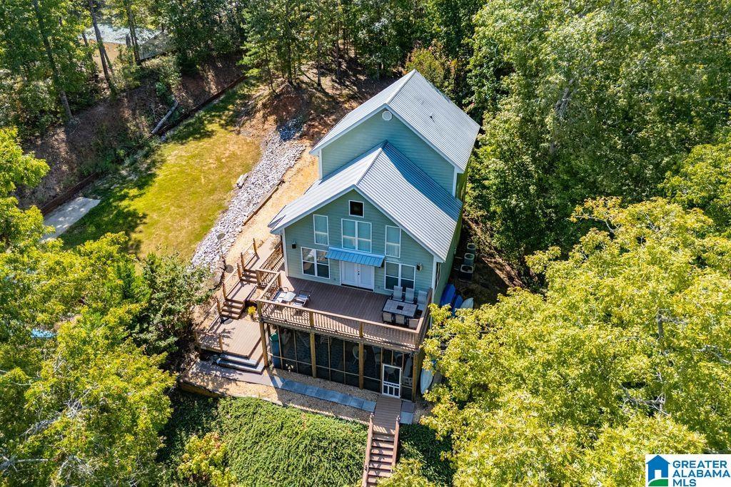 Image 2: DRONE VIEW OF LAKE SIDE OF HOME