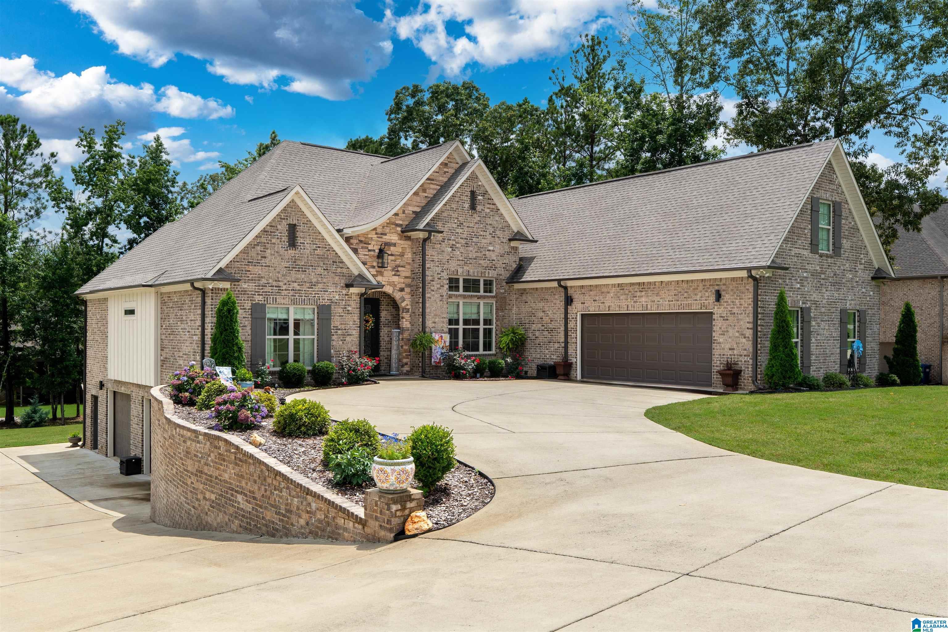Image 4: Front home with 2 car garage on Main