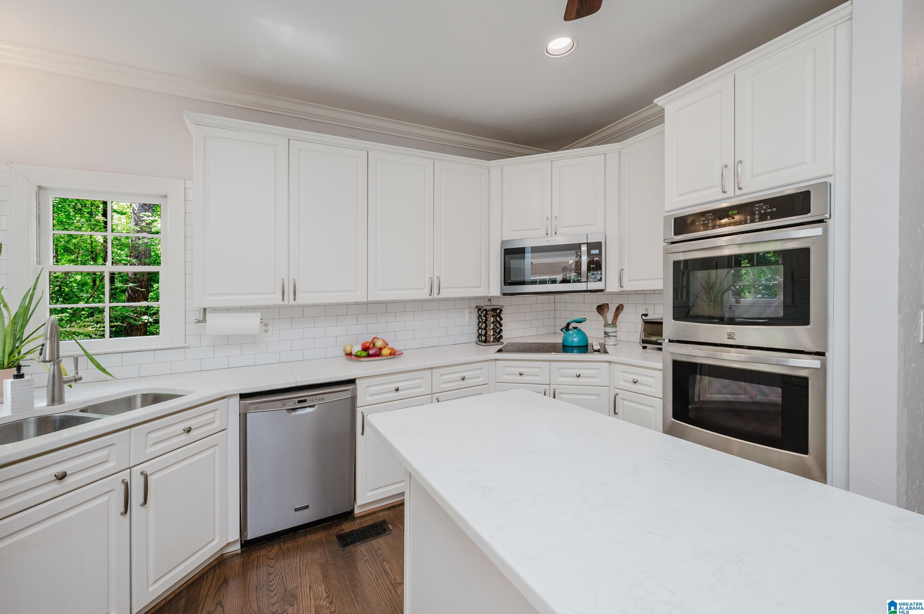 Image 4: Bright, white, update kitchen will make you smile