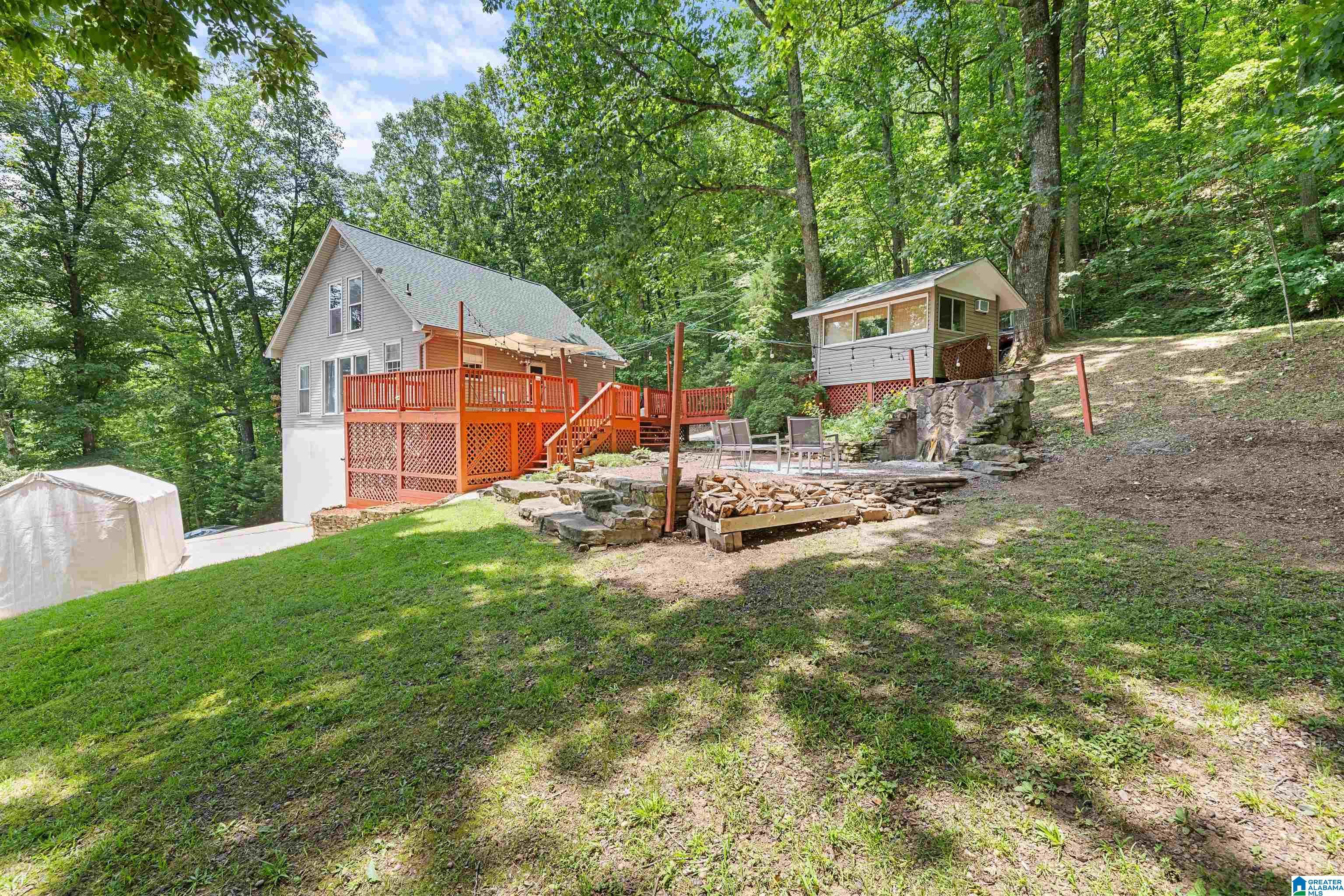 Image 1: View of Back yard with Fire Place